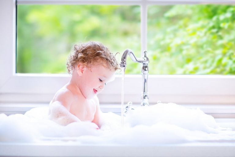 toddler taking a bath