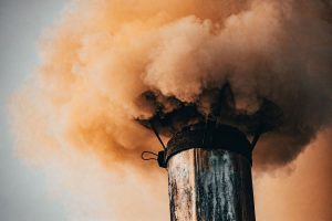 factory chimney producing smoke